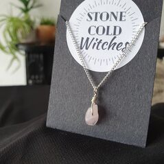 Small rose quartz polished crystal on a dainty silver chain, bound using a simple silver wire wrap